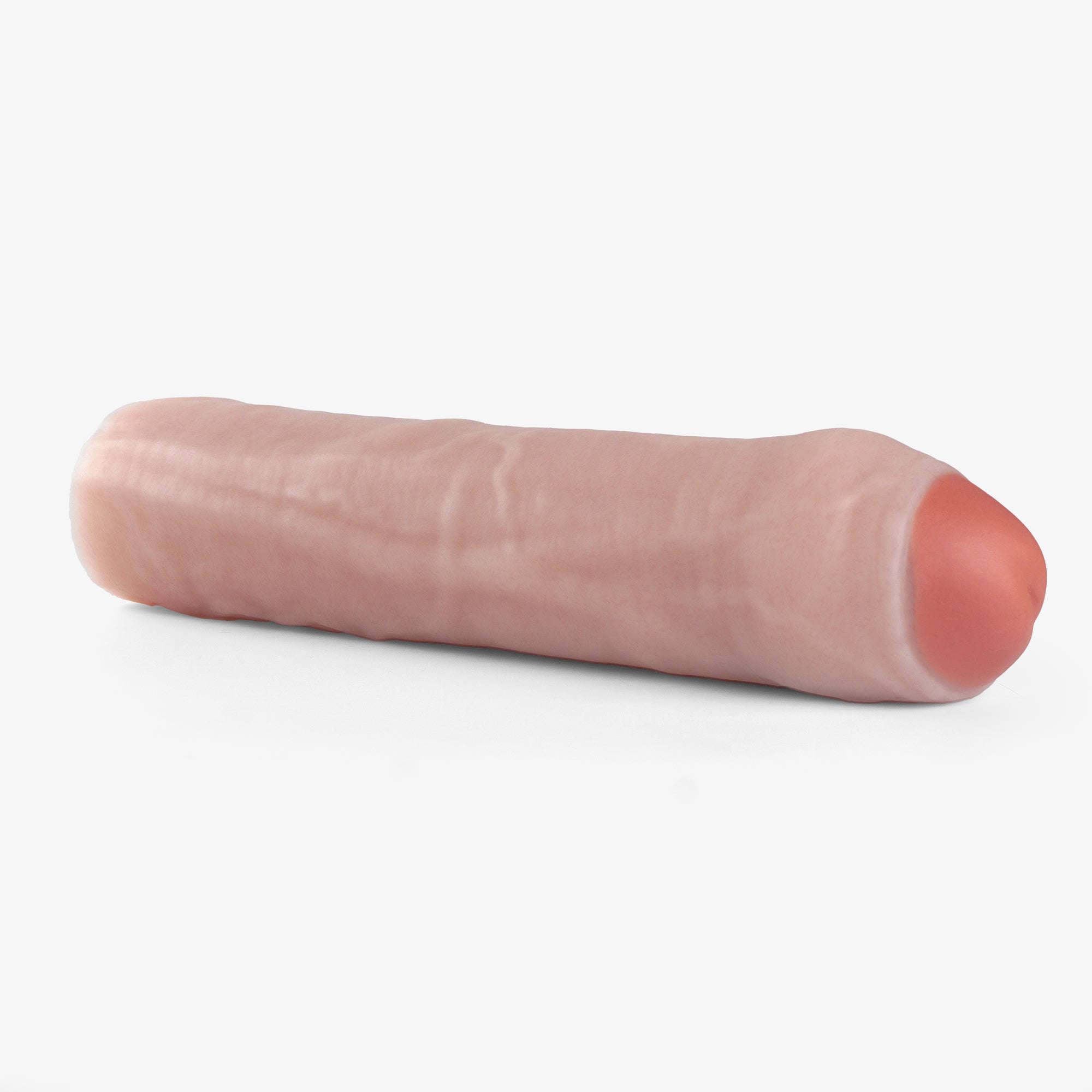 The made to measure uncut penis extender laying down.