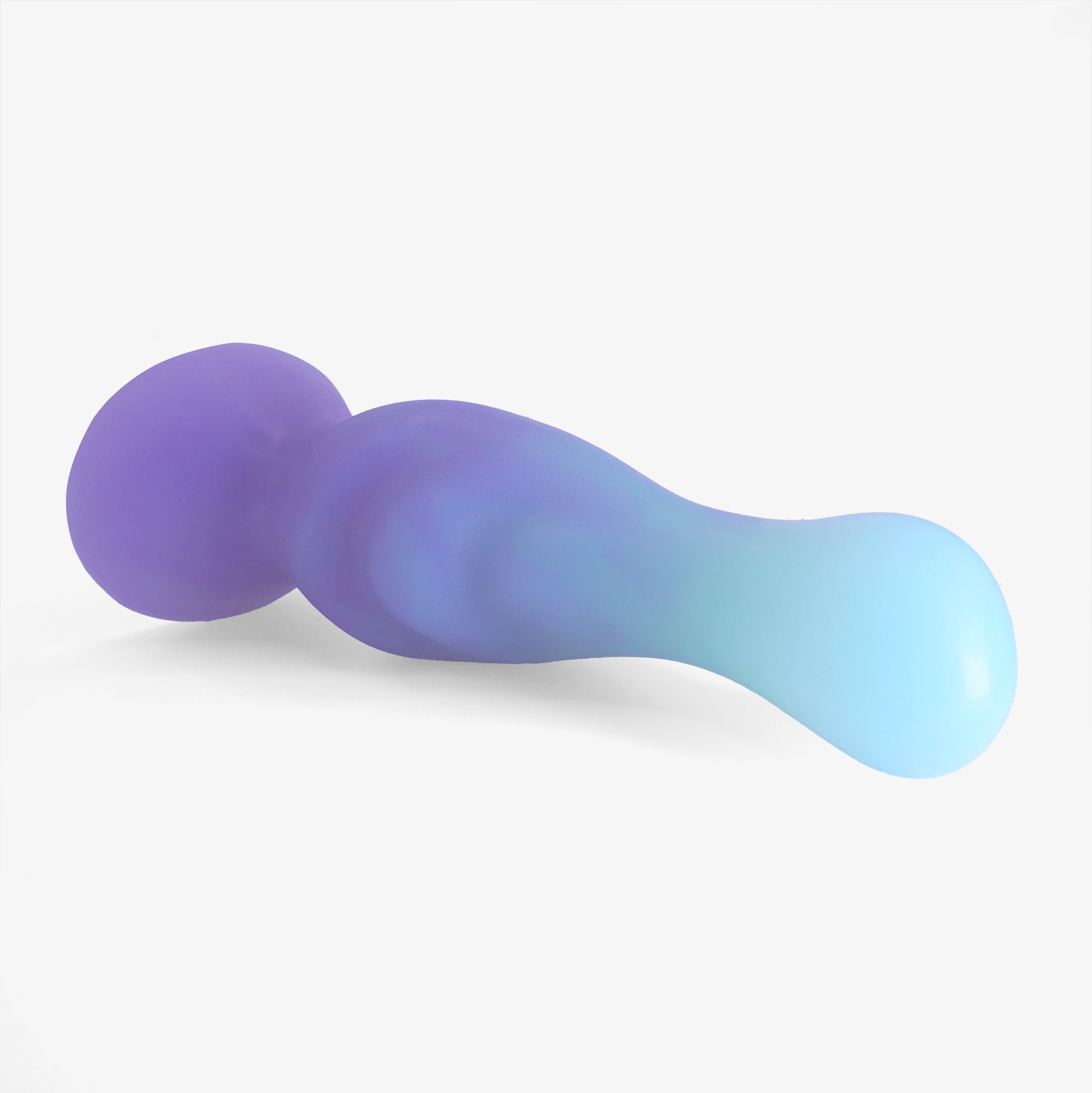 The pinpoint dildo laying down.