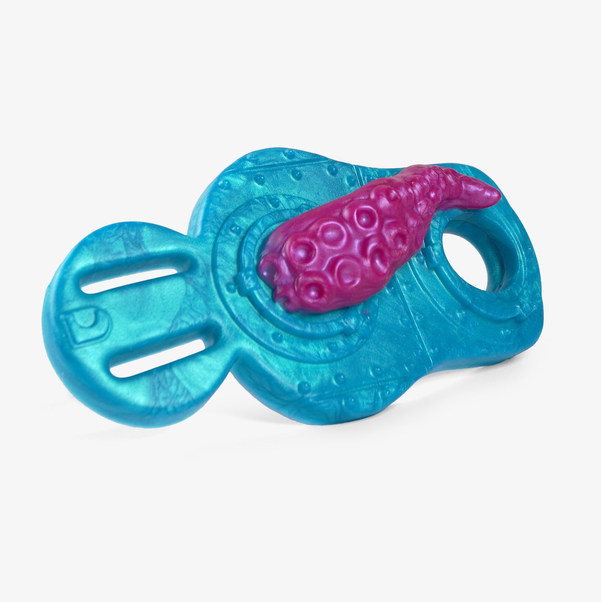 The tentacle grinder iv cock ring laying down.