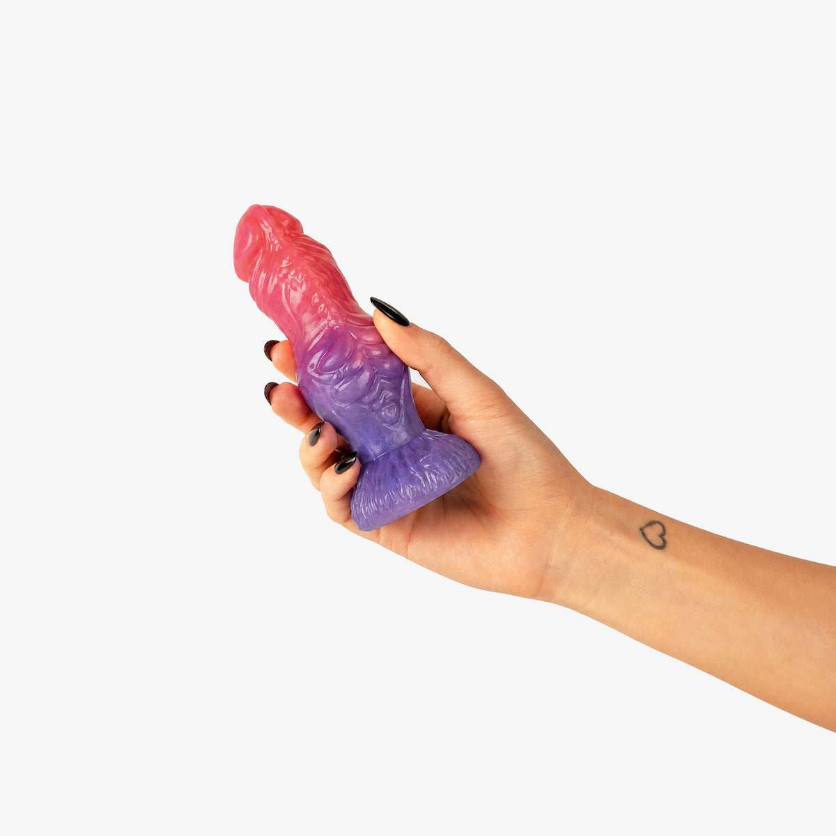 The Werewolf Dildo, held in hand, platinum-cure silicone dildo