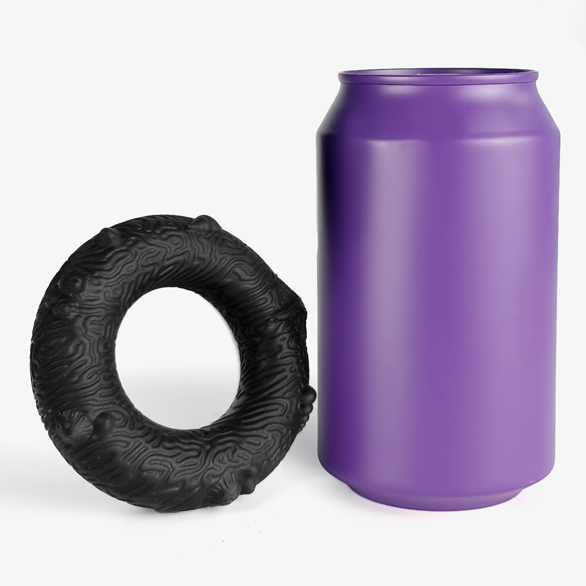 The coral cock ring size comparison next to 330ml can.
