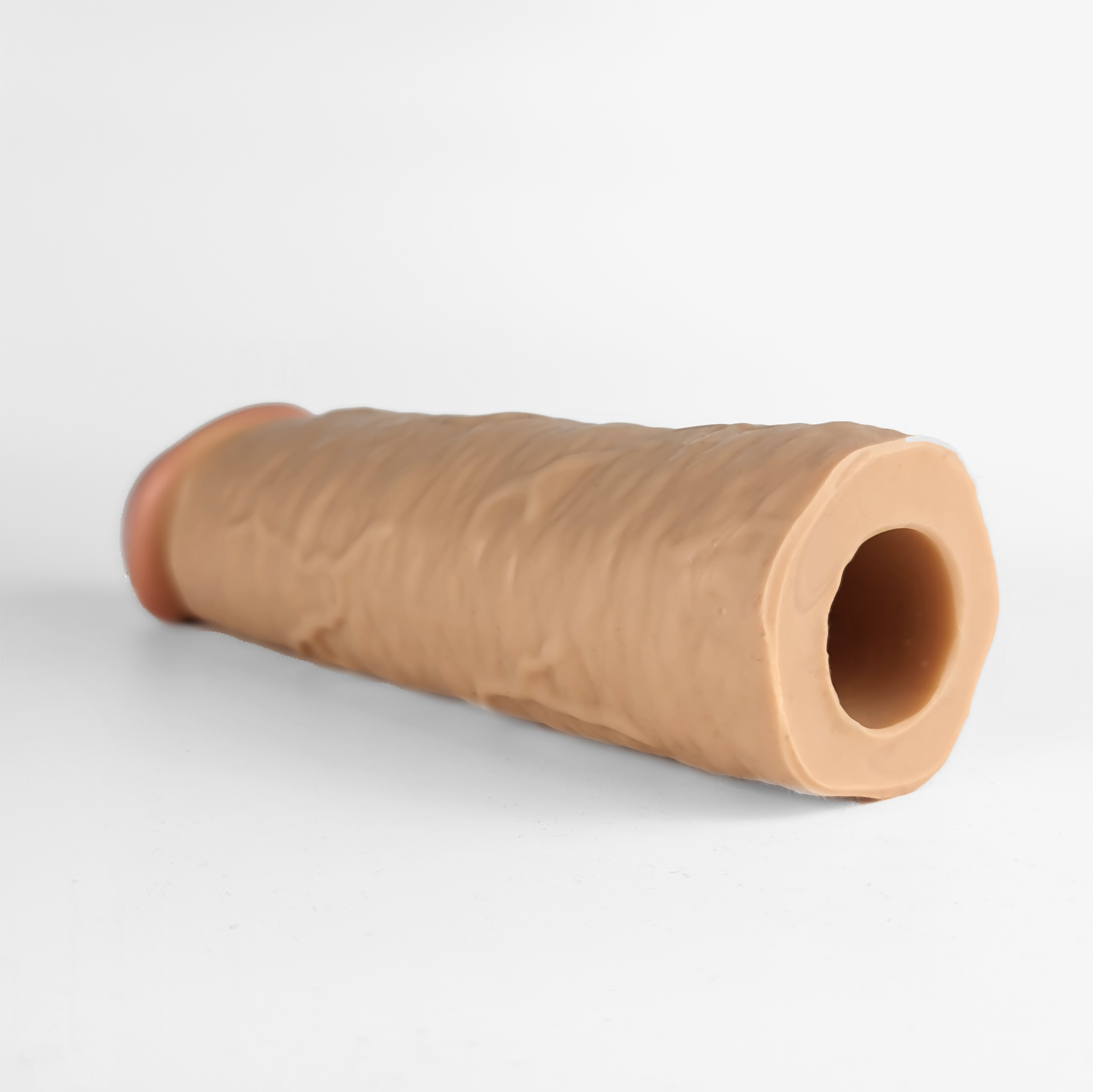 The made to measure og penis extender laying down.