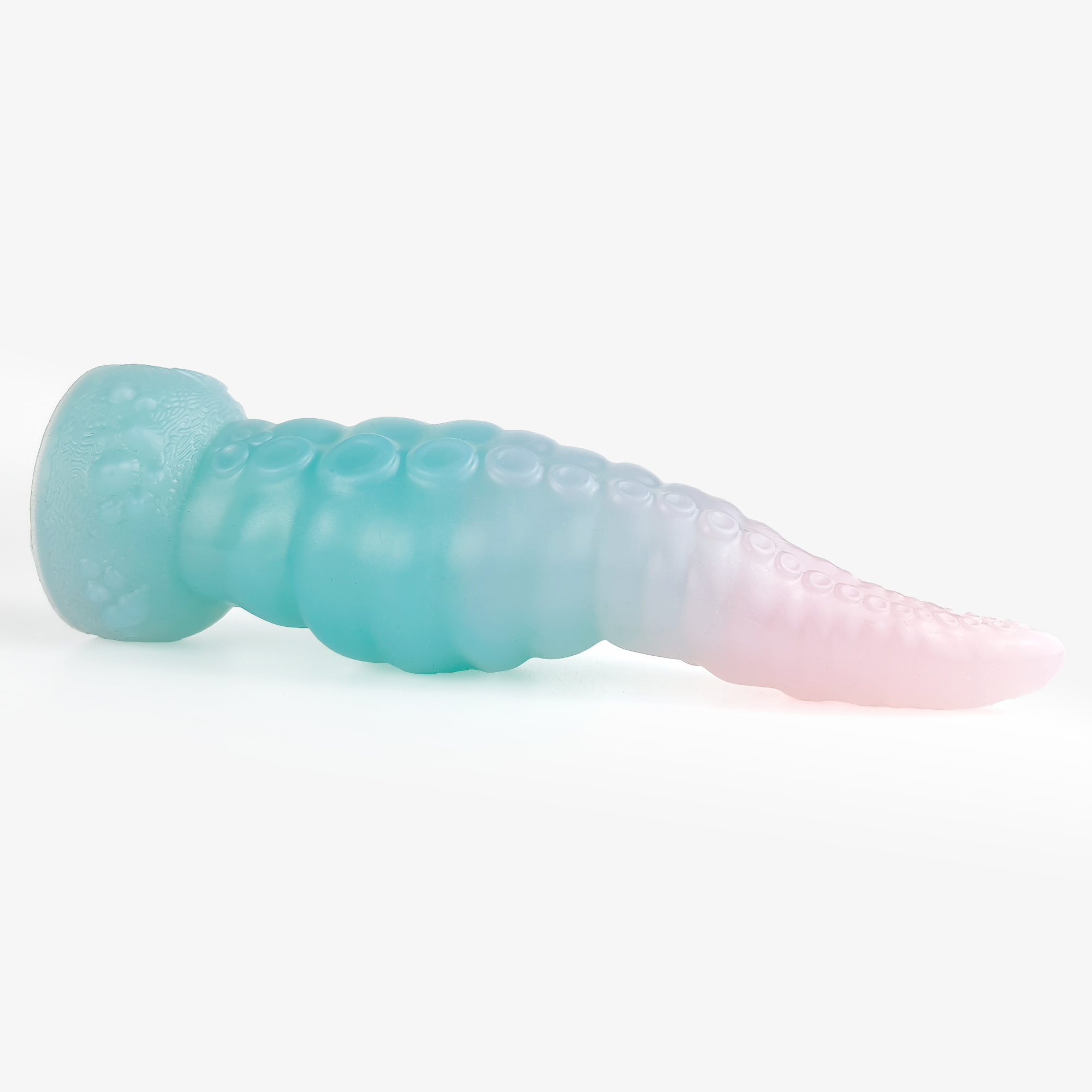 The tentacle: knot dildo laying down.