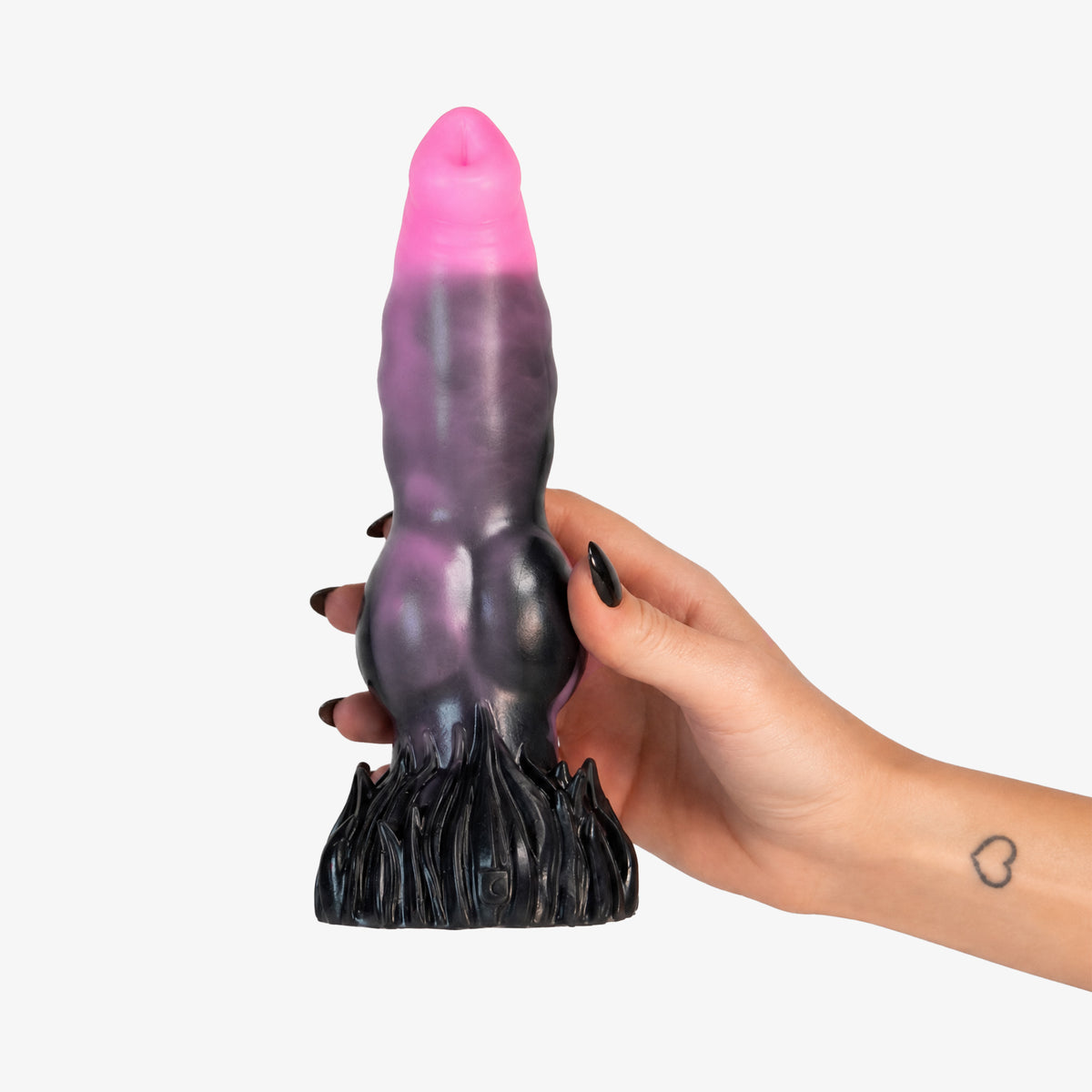 The Knot IV Dildo, held in hand, platinum-cure silicone dildo
