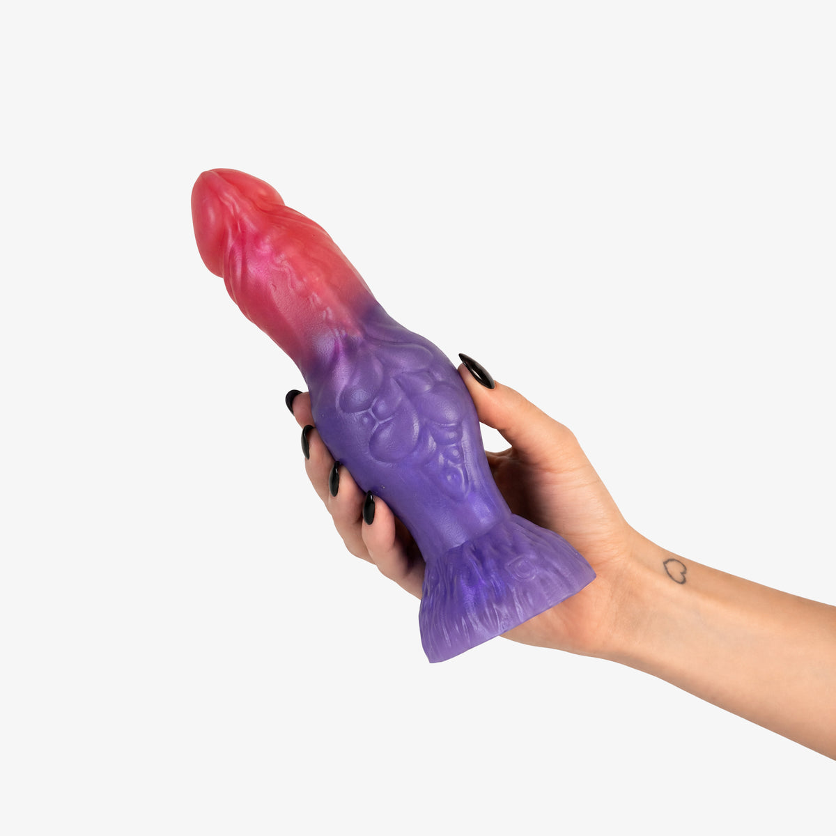 The Werewolf Dildo, held in hand, second shot, platinum-cure silicone dildo